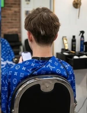 Back view in patterned shirt